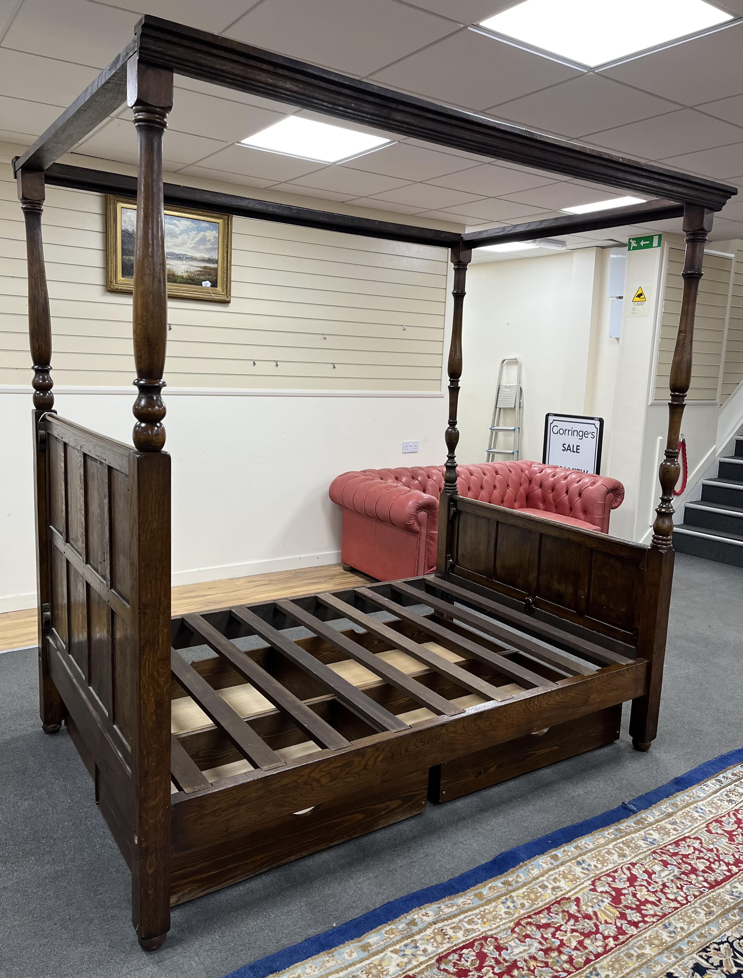 A reproduction 17th century style oak four poster bed frame, width 140cm, length 210cm, height 223cm. Condition - good